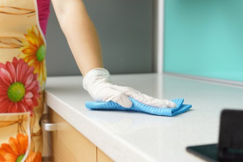 Professional cleaners preparing a tidy living room in Cleaninghome