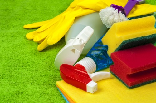 Staff using PPE while carrying out careful cleaning tasks