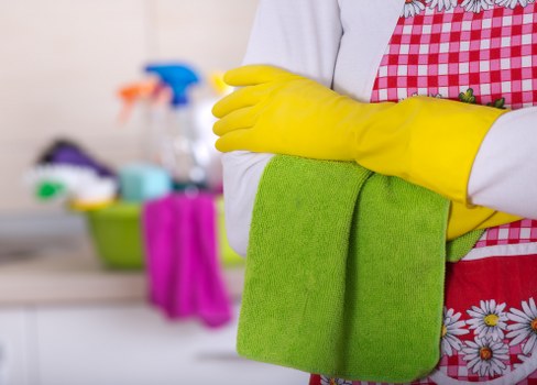 Staff using approved cleaning products safely