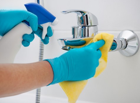 Cleaner working with trained safety procedures in a home environment